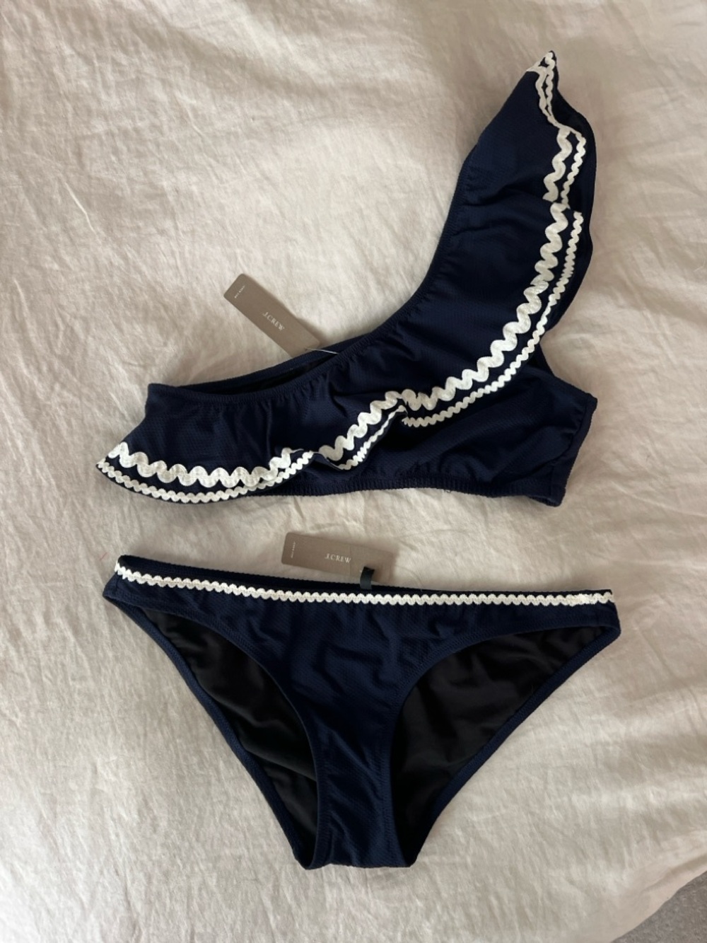 J. Crew Women’s Navy Ruffle Bikini Set with White Scalloped Trim.